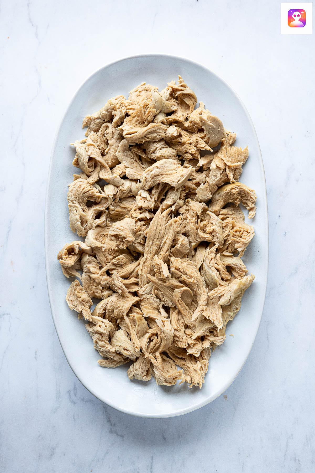 Shredded seitan chicken on a plate.